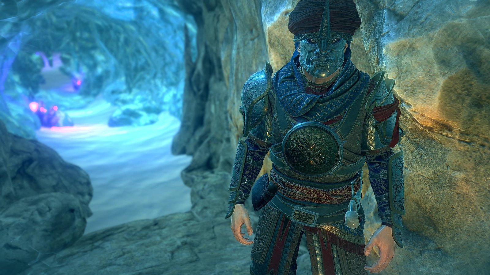 man in metal mask with ornate armor standing to the right in an icy cave